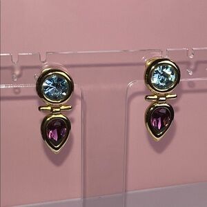 Elegant Gold tone dangle Earrings with a blue & purple rhinestone